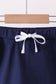 Navy scallop hem bow skort