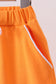 Orange scallop hem bow skort