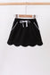 Black scallop hem bow skort