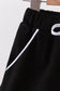 Black scallop hem bow skort