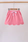 Deep pink scallop hem bow skort