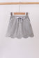 Grey scallop hem bow skort