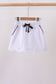 Snow white scallop hem bow skort