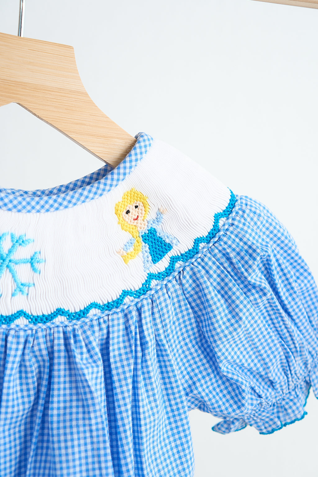 Blue snow princess hand smocked gingham girl romper