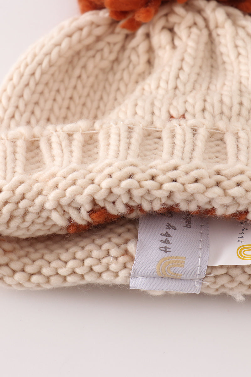 Beige pompom hi cable beanie