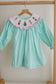 Mint christmas nutcracker hand smocked gingham dress