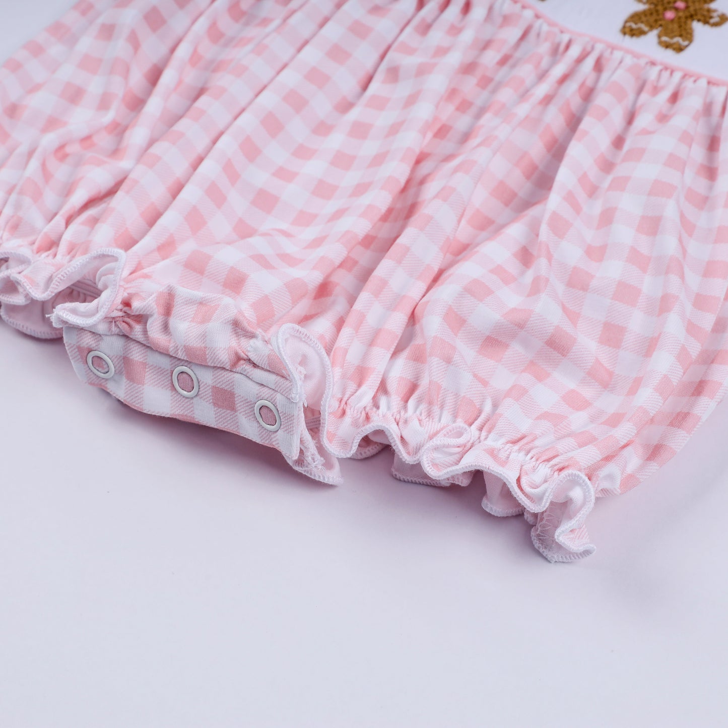 Pink gingerbread hand smocked gingham ruffle bubble