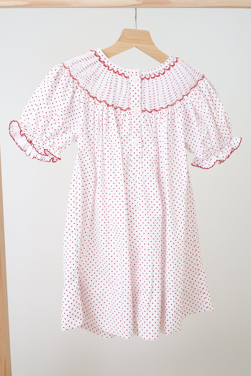 Pink christmas bishop hand smocked dot dress