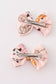 Pink pumpkin piggie hair bow