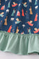 Navy nativity print ruffle gown