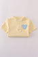 Yellow character applique shorts set