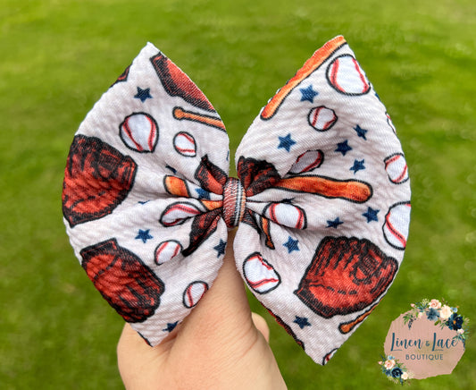 Cream baseball bows